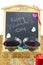 Blackboard with hearts and and two glasses