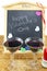 Blackboard with hearts and and two glasses