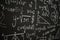 Blackboard inscribed with scientific formulas and calculations in physics, mathematics and electrical circuits. Science and
