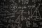 Blackboard inscribed with scientific formulas and calculations in physics, mathematics and electrical circuits. Science and