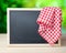 Blackboard menu recipe frame picnic cloth background.