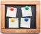 Blackboard and post-it notes stuck with colorful magnets