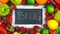 Blackboard surrounded by healthy food,