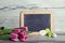 Blackboard with tulips and Easter eggs