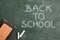 Blackboard with white chalk and eraser back to school top