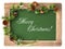 Blackboard with wooden frame and christmas decoration