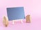 Blackboard for writing your text with house, tree wooden toy on pink background