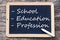 On a blackboard is written - school - education - profession