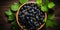 Blackcurrant banner. Bowl full of blackcurrant. Close-up food photography background