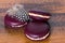 Blackcurrant macarons on wood background