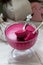 Blackcurrant, orange and cream mousse in a glass bowl. Rustic style