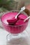 Blackcurrant, orange and cream mousse in a glass bowl. Rustic style.