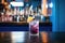 blackcurrant soda on a bar counter with blue backlight