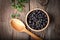 Blackcurrant in wooden bowl.