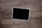 Blacked out old vintage photo template on wooden background