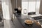 Blackish Open Kitchen interior in Modern apartment, Nuts, Dried Plants on the Kitchen Counter, Daylight. Modern Style Home Decor