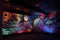 blacklight and uv-reactive mural, depicting the night sky with stars and planets