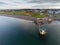 Blackrock public diving board at sunrise. Salthill, Galway city, Ireland. Popular town landmark. Aerial drone view. Dramatic light