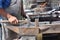Blacksmith beating iron in old fashion
