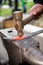 Blacksmith forges a sword on an anvil