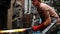 Blacksmith forging the molten metal with hammer machine