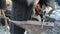 Blacksmith man hammer forge hot iron piece anvil spring festival
