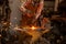 The blacksmith manually forging the molten metal on the anvil in smithy with spark fireworks.