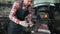 Blacksmith at work with electric hammer near the anvil, red hot steel, manufacturing