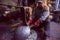 Blacksmith workers using mechanical hammer at workshop