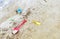 Blades and buckets for sculpting pastes on the sand. Children's toys on the beach. Scattered on the sand are the
