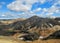 Blahnukur mountain and rhyolite mountains covered with snow in Landmannalaugar geothermal region, South Iceland