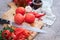 blanched peeled tomatoes on wooden cutting board at domestic kitchen