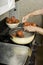 Blanching tomatoes for canning.