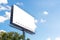 Blank advertising billboard advertisement for adjust your message at city with nice sky , mock up selective focus with clipping