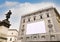 Blank advertising billboard on the scaffolding of the facade of an ancient building under restoration