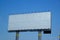 Blank aluminium billboard on blue sky background, ready for new advertisement