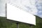 Blank big billboard against green mountain and blue sky background,for your advertising,put your own text here