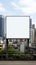 Blank billboard frame nestled amidst a bustling urban landscape, open canvas for creativity