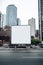 Blank billboard frame nestled amidst a bustling urban landscape, open canvas for creativity