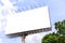 Blank billboard with rusted structure against blue sky for advertisement