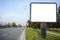 Blank Billboard in the side of a road , fork or crossroad with b