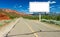 Blank Billboard Sign by Highway in Desert