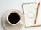 Blank binder notebook and pen with coffee cup