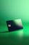 Blank black credit card with microchip on green, copy space, created using generative ai technology