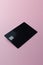 Blank black credit card with microchip on pink, copy space, created using generative ai technology
