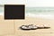 Blank black signboard on the beach