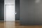 Blank black wall in empty office hall with elevator and wooden glossy floor. 3D rendering