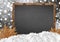 Blank blackboard with blurr forest and snow and leaves