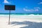 Blank blackboard display on tropical beach