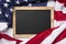 Blank blackboard over American flag as a concept for US national celebrations
